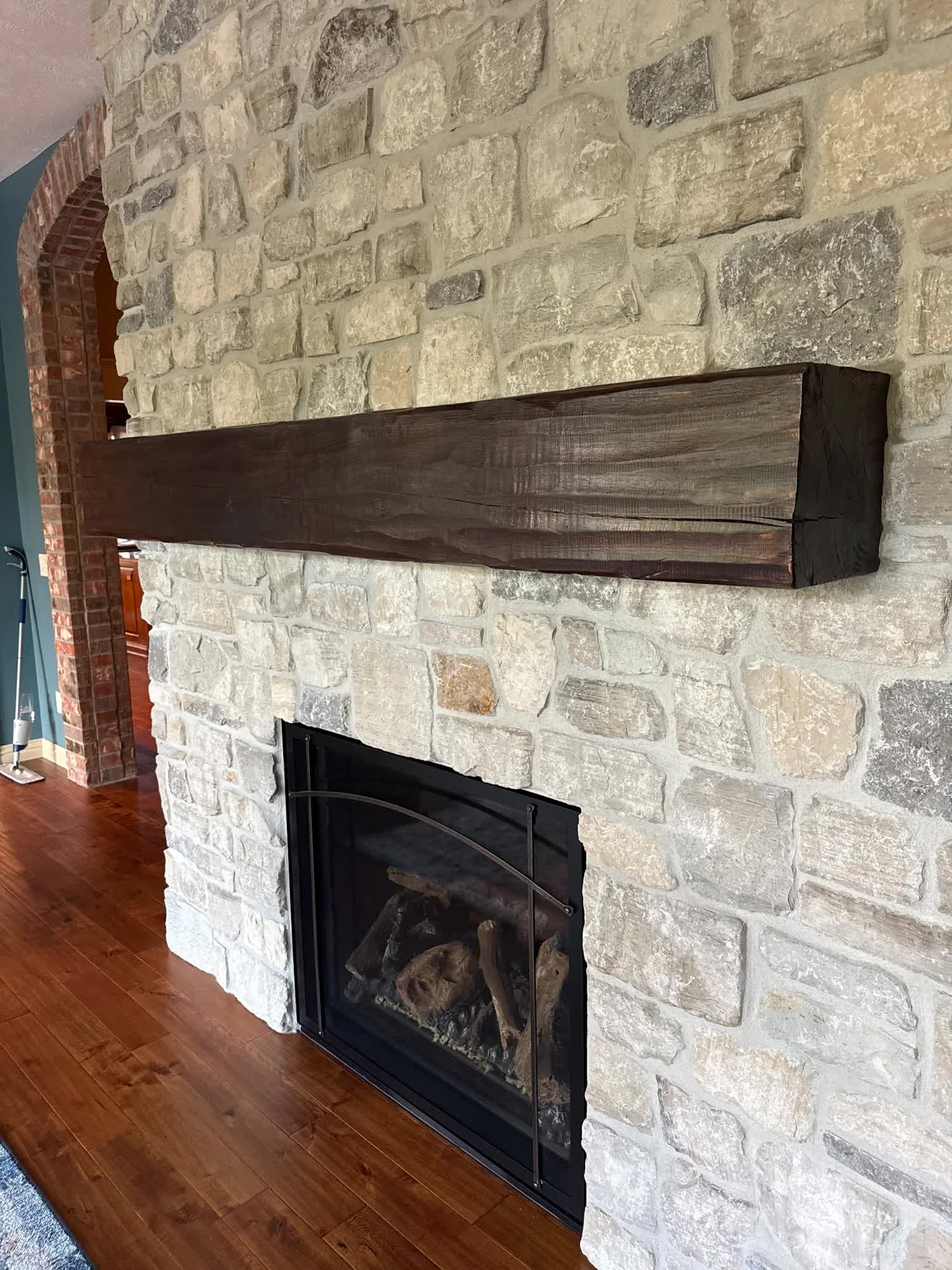 Fireplace mantel with the wrong dark stain, before laser cleaning — Springfield, MO